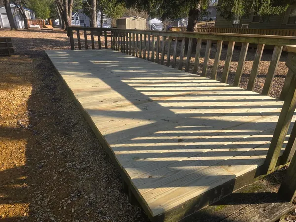 a view of balcony with wooden floor