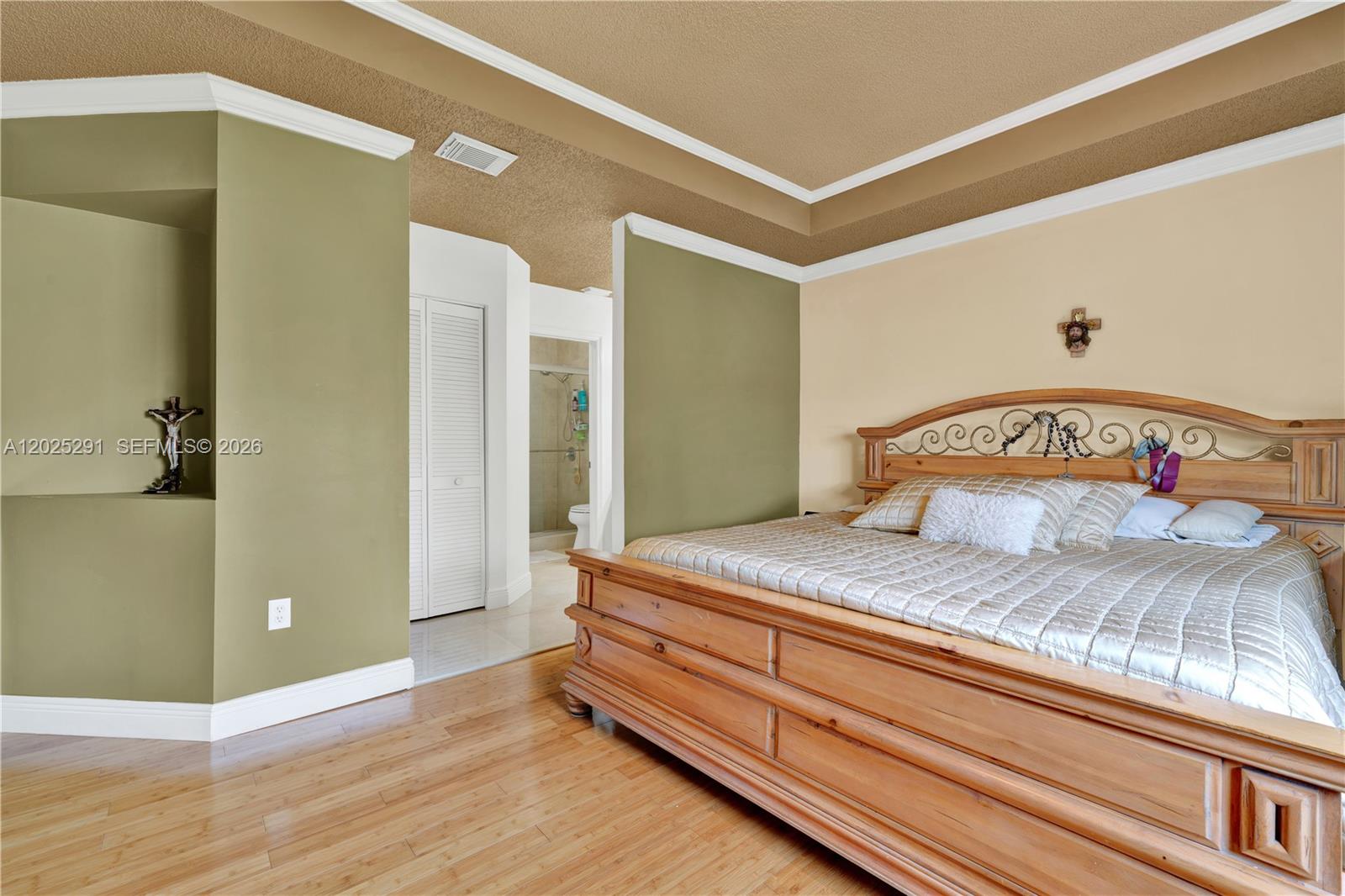 10006 Southwest 162nd Path Miami, FL 33196 - Photo 19 of 40 a bedroom with a bed and wooden floor