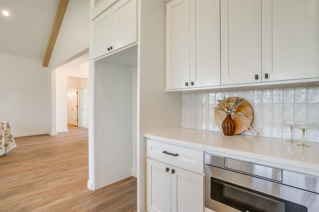9012 Valley Oak Court Springtown, TX 76082 - Photo 15 of 40 a kitchen with a refrigerator and cabinets