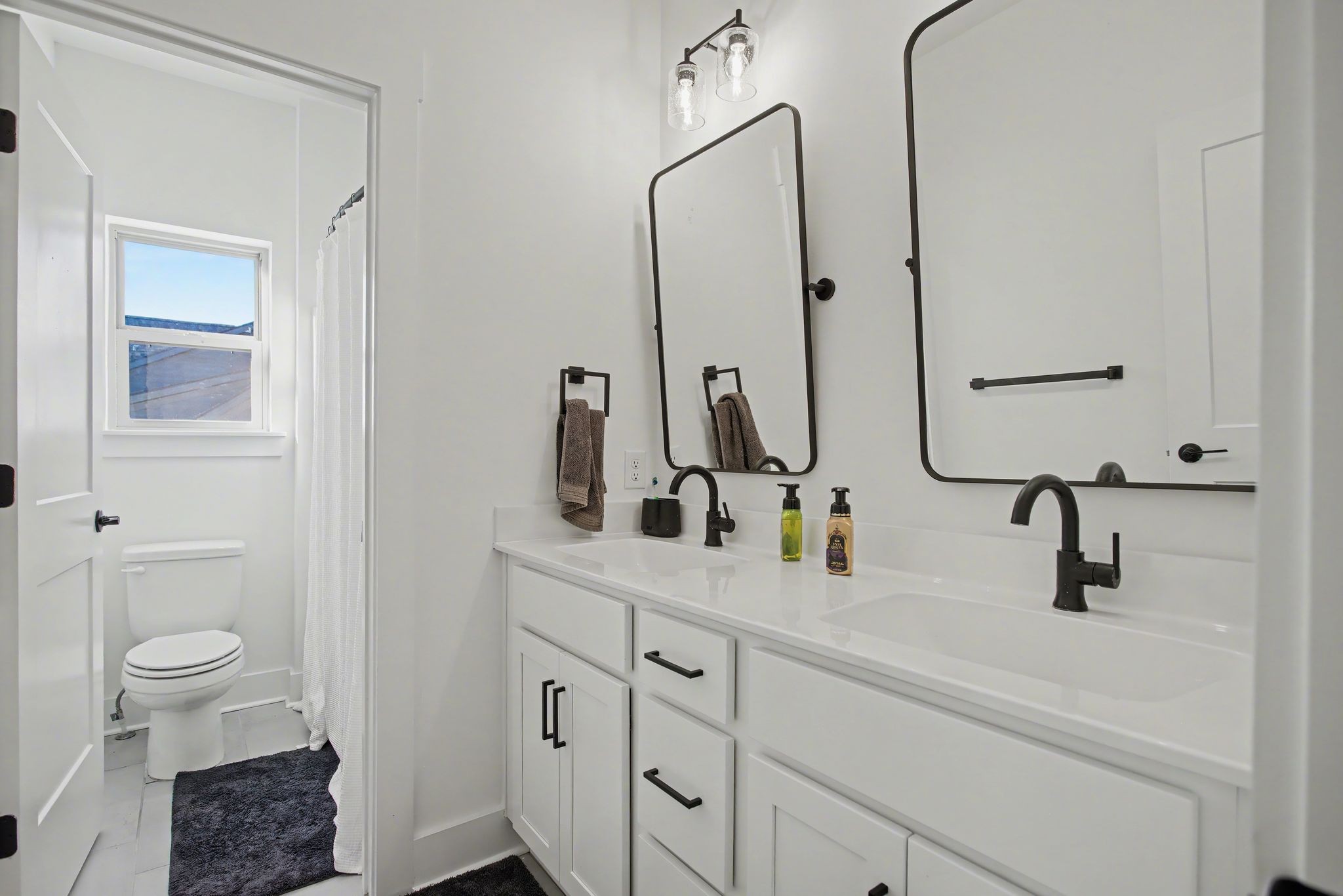 194 Phillips Bend Spring Hill Spring Hill, TN 37174 - Photo 44 of 53 a bathroom with double vanity sink a toilet and a mirror