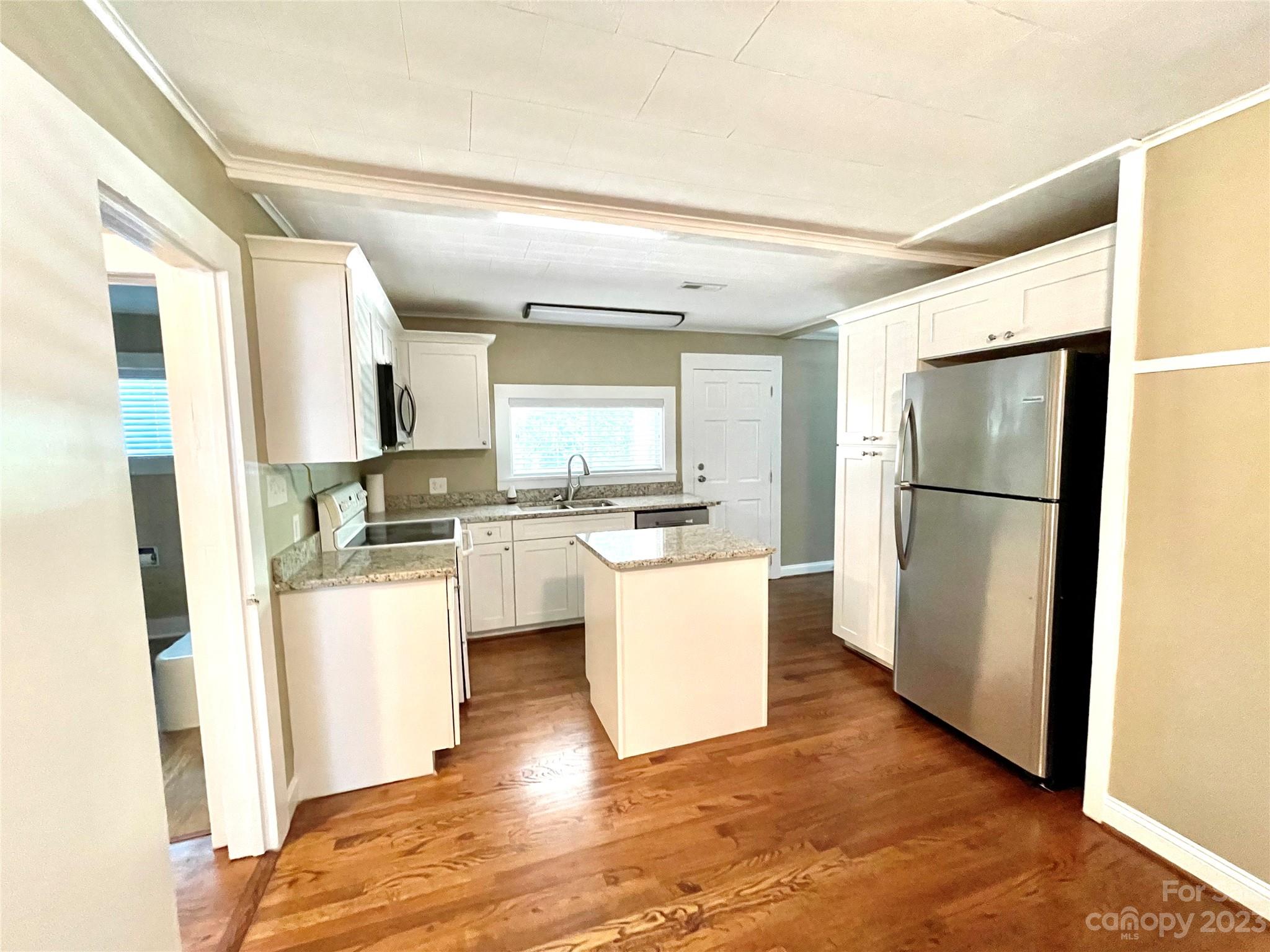 3270 West Innes Street Salisbury, NC 28144 - Photo 14 of 33 a kitchen with a refrigerator and white cabinets