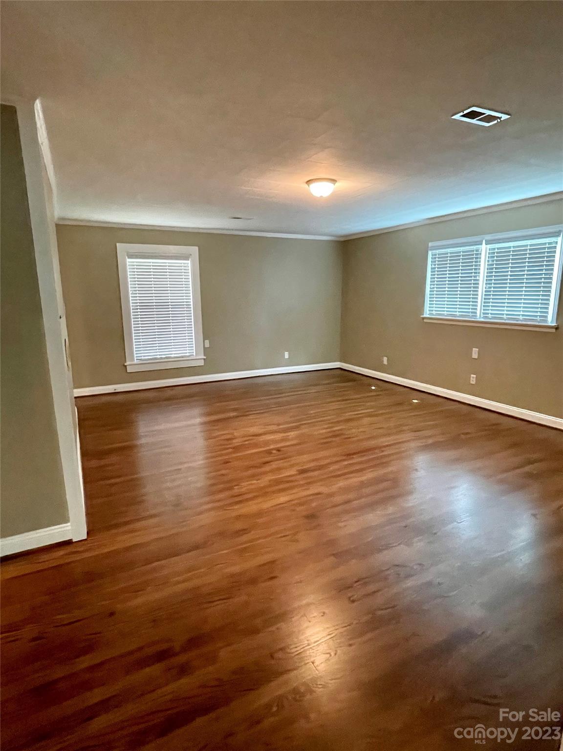 3270 West Innes Street Salisbury, NC 28144 - Photo 16 of 33 a view of an empty room with wooden floor and a window