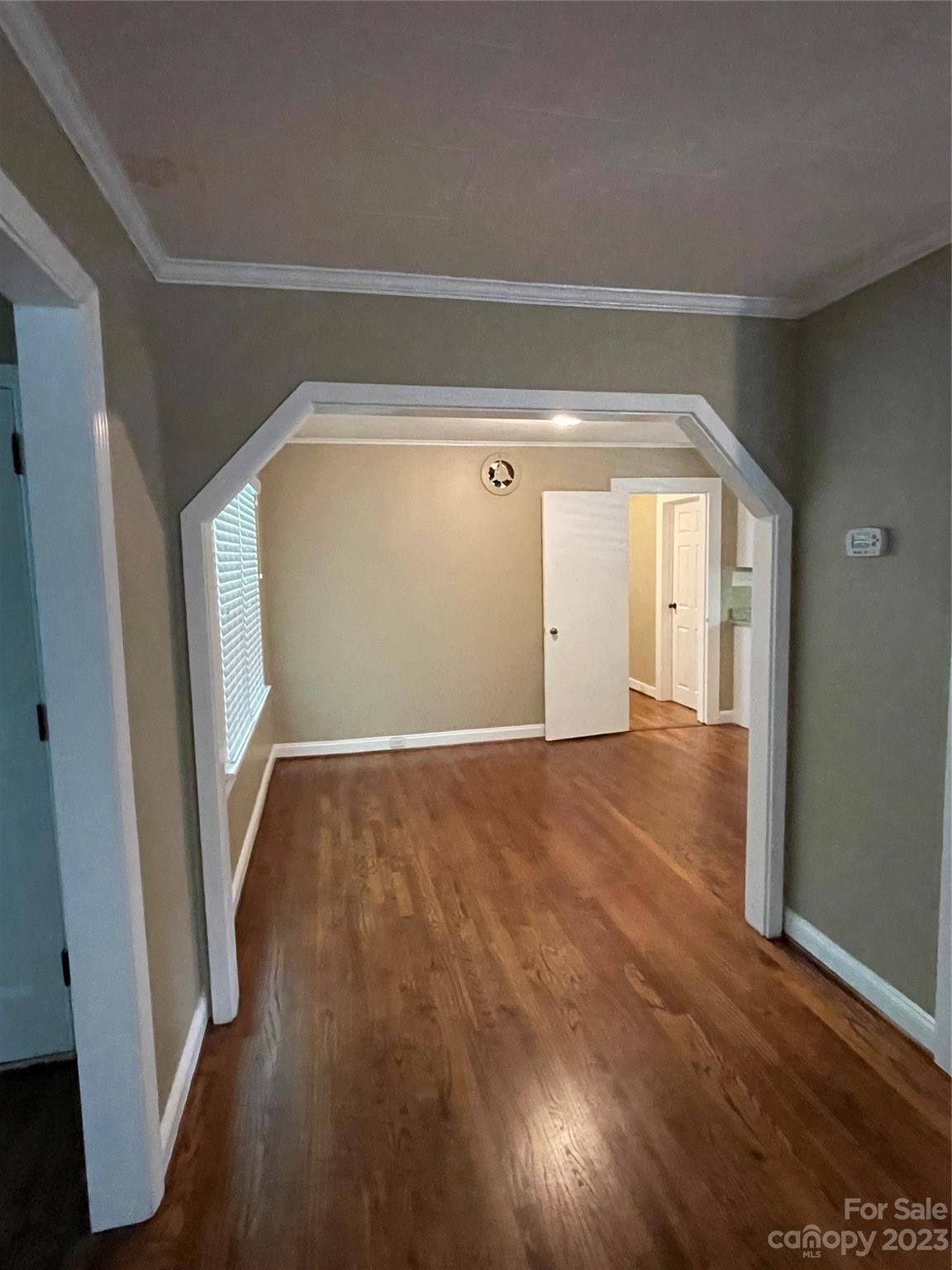 3270 West Innes Street Salisbury, NC 28144 - Photo 19 of 33 an empty room with wooden floor and windows