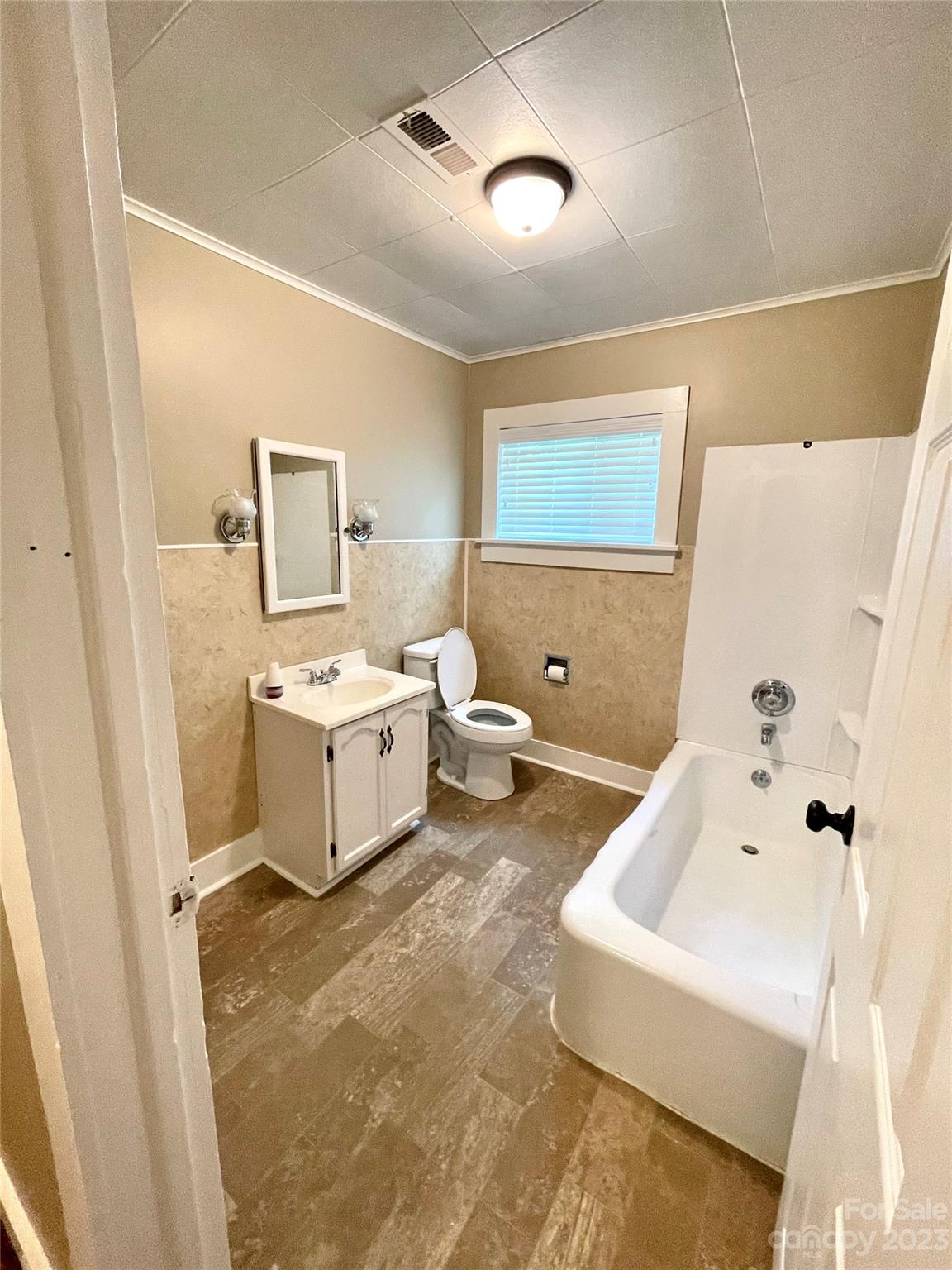 3270 West Innes Street Salisbury, NC 28144 - Photo 23 of 33 a bathroom with a sink a toilet and a bathtub