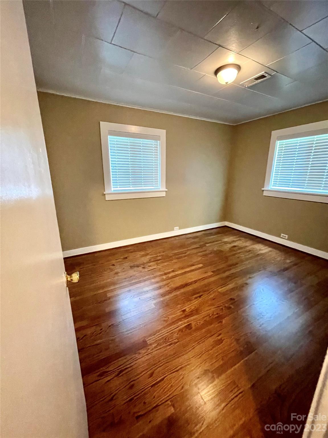 3270 West Innes Street Salisbury, NC 28144 - Photo 24 of 33 an empty room with wooden floor and windows