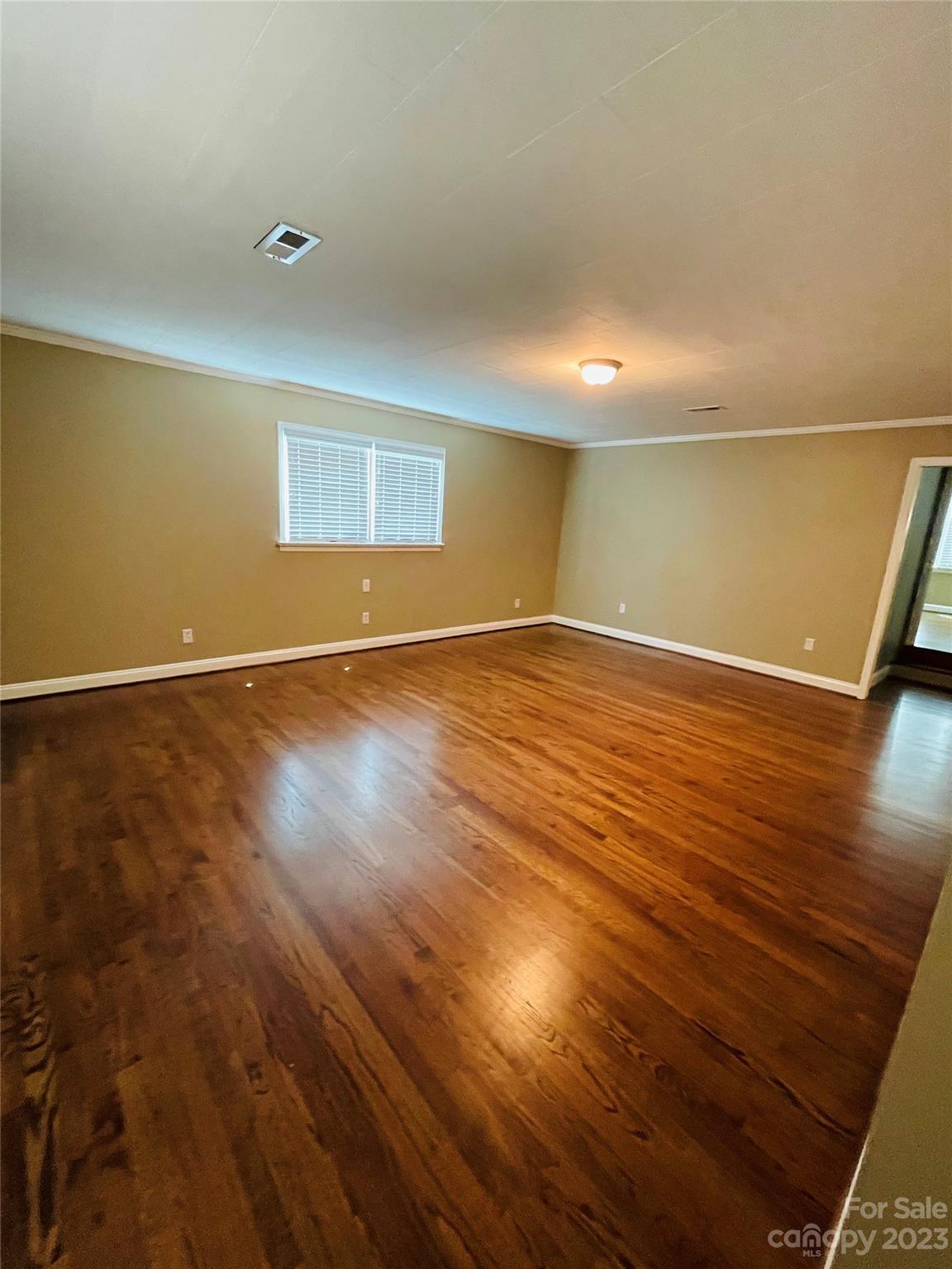 3270 West Innes Street Salisbury, NC 28144 - Photo 26 of 33 an empty room with wooden floor and windows