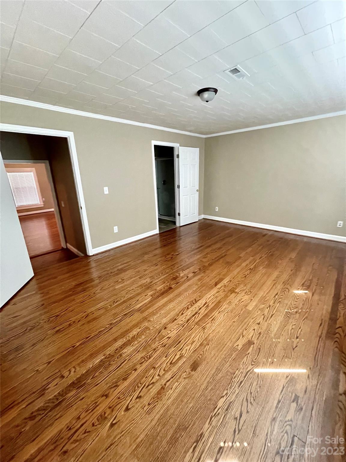 3270 West Innes Street Salisbury, NC 28144 - Photo 28 of 33 a view of an empty room with wooden floor and a window