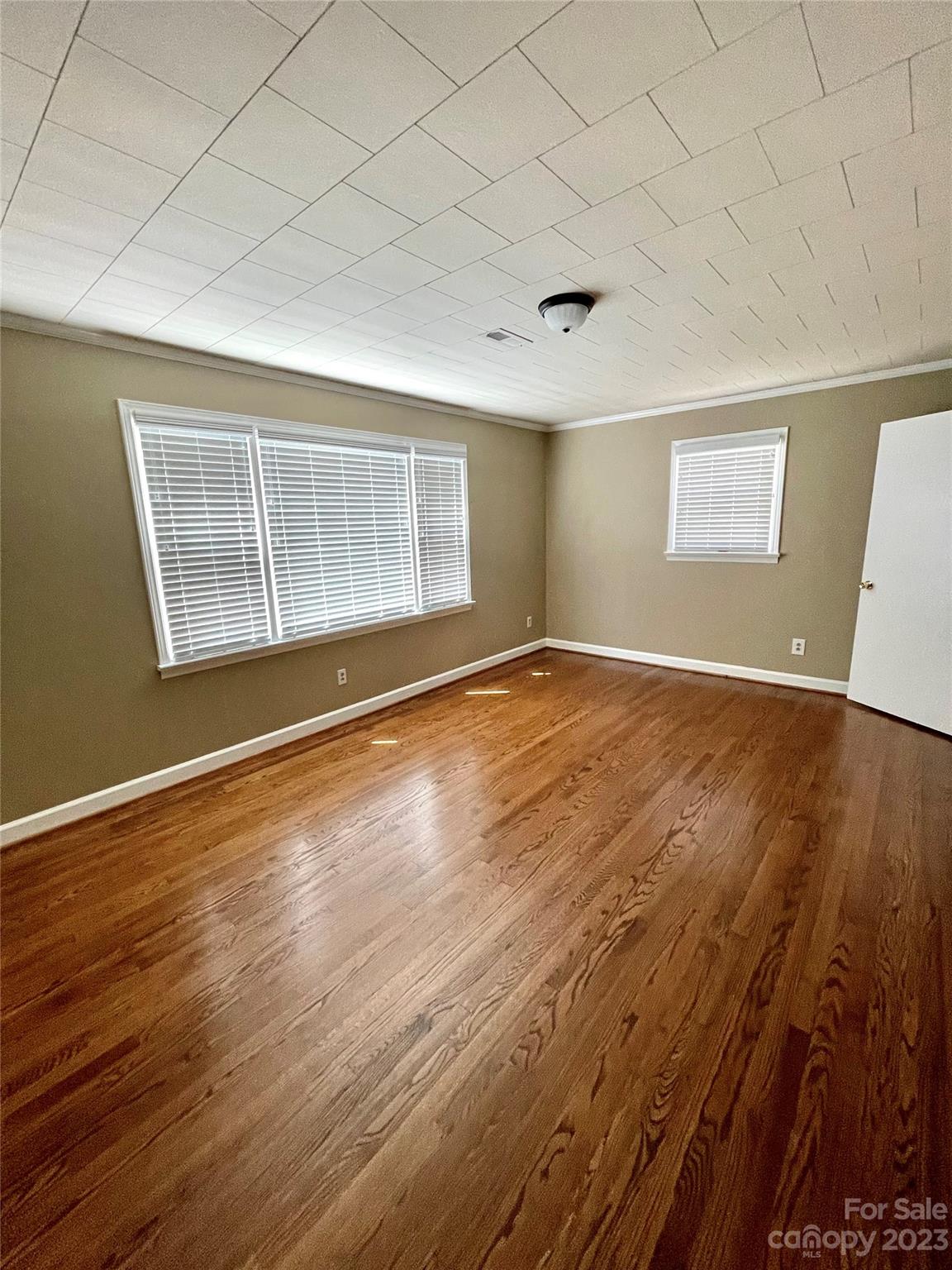 3270 West Innes Street Salisbury, NC 28144 - Photo 29 of 33 an empty room with wooden floor and windows