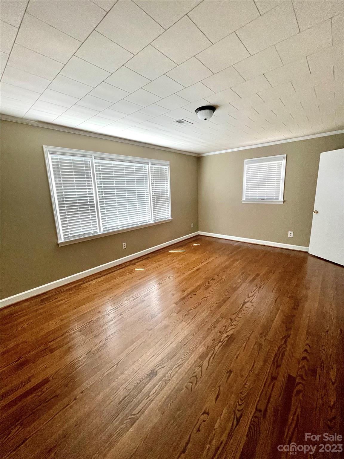 3270 West Innes Street Salisbury, NC 28144 - Photo 30 of 33 an empty room with wooden floor and windows