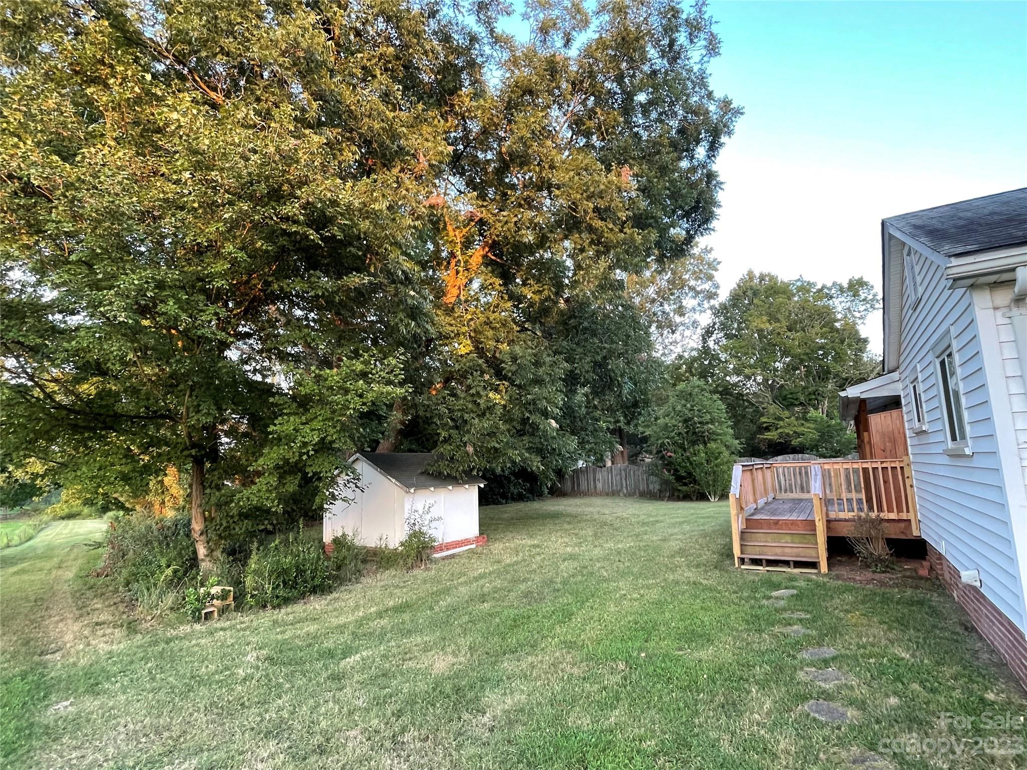 3270 West Innes Street Salisbury, NC 28144 - Photo 4 of 33 a backyard of a house with a garden and entertaining space