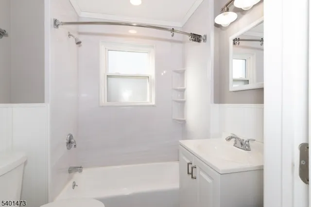 a bathroom with a bathtub a shower a sink and a toilet
