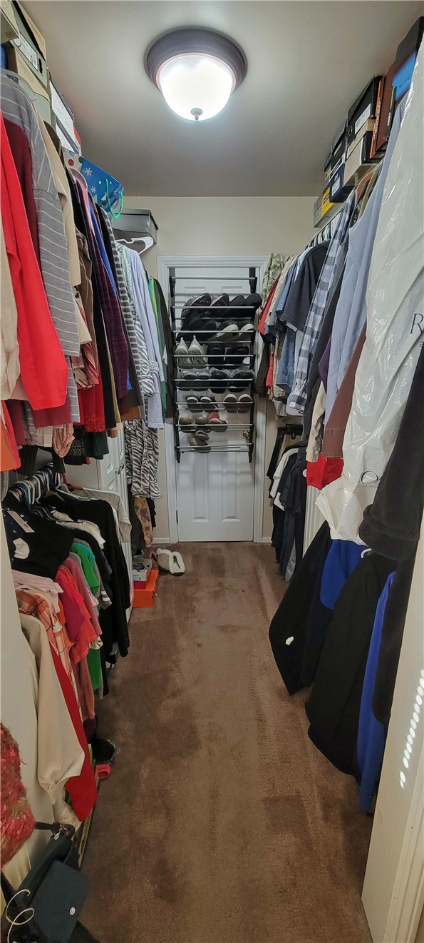 5322 Coney Road Los Angeles, CA 90032 - Photo 11 of 22 a view of walk in closet with clothes and shoes