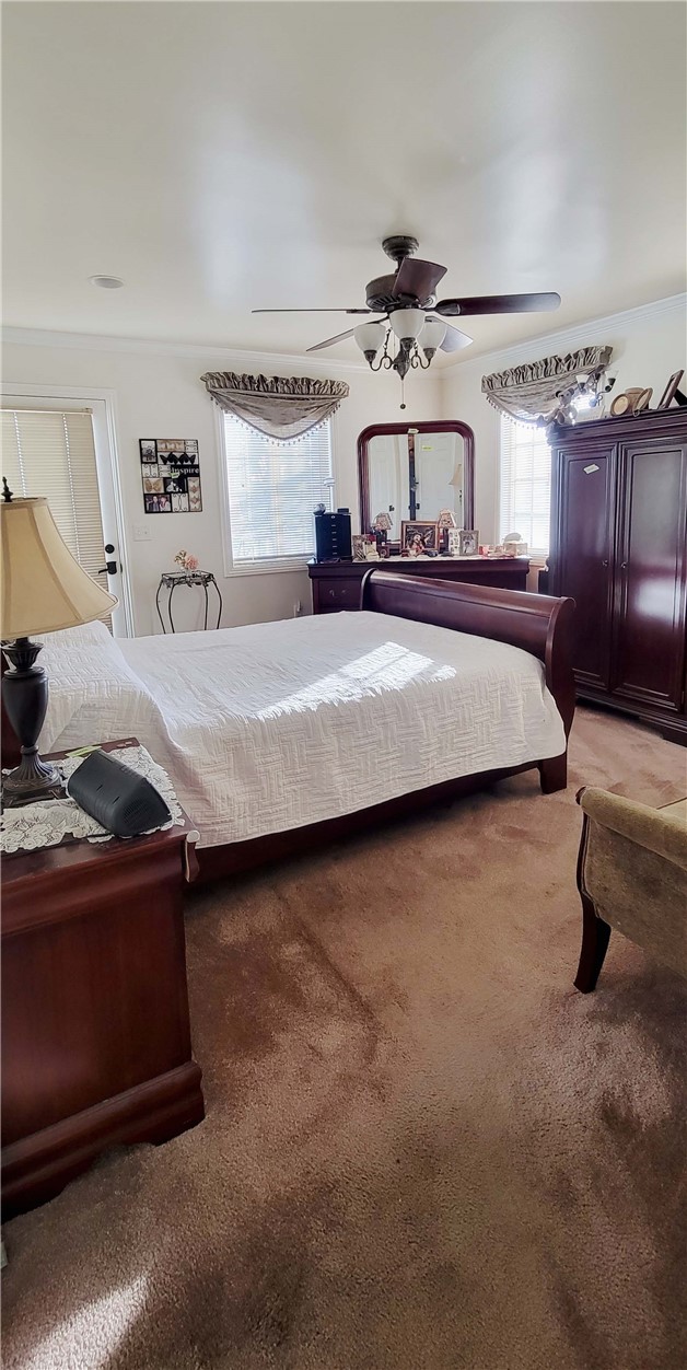 5322 Coney Road Los Angeles, CA 90032 - Photo 13 of 22 a bedroom with a bed and a chandelier