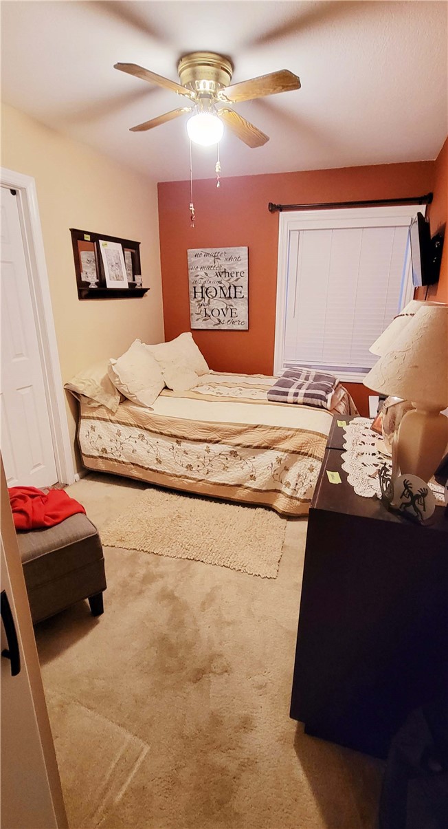 5322 Coney Road Los Angeles, CA 90032 - Photo 10 of 22 a bedroom with a bed and a chandelier