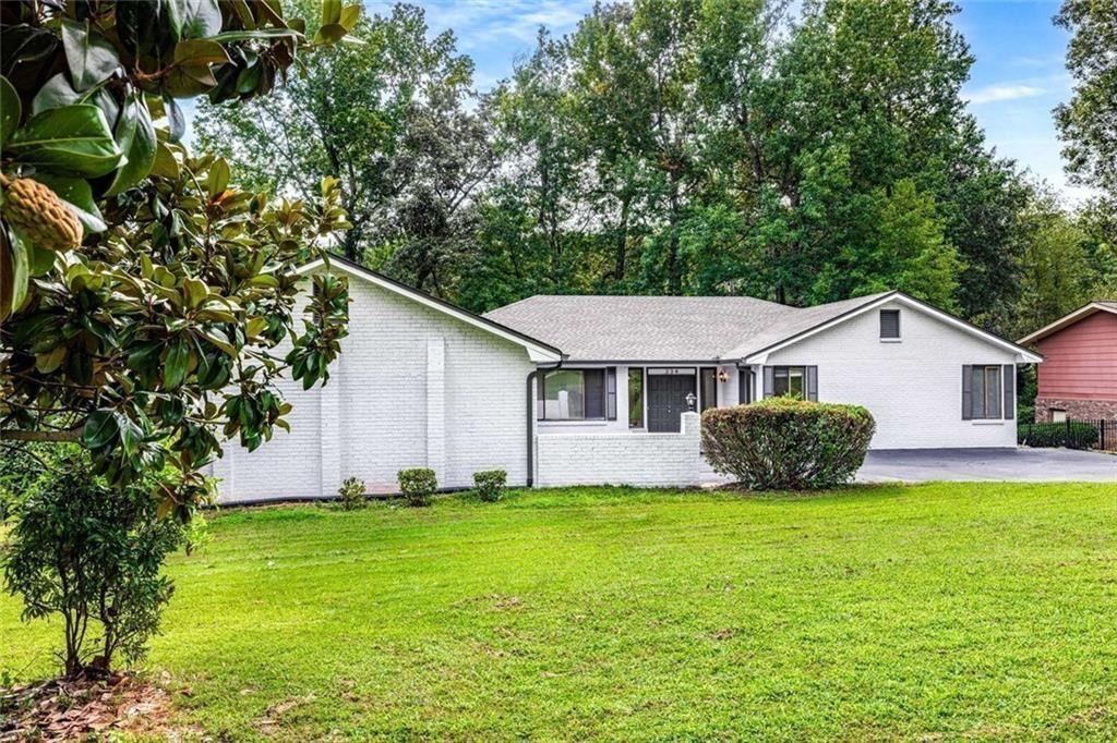 234 Shadow Lake Drive Southwest Lilburn, GA 30047 - Photo 12 of 36 a view of a house with a yard