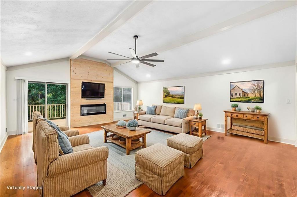 234 Shadow Lake Drive Southwest Lilburn, GA 30047 - Photo 13 of 36 a living room with furniture ceiling fan and a window