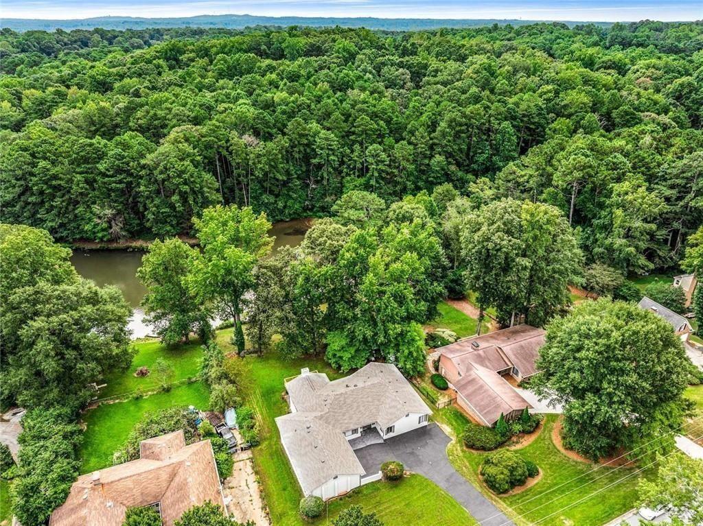 234 Shadow Lake Drive Southwest Lilburn, GA 30047 - Photo 4 of 36 an aerial view of a house with yard swimming pool and outdoor seating