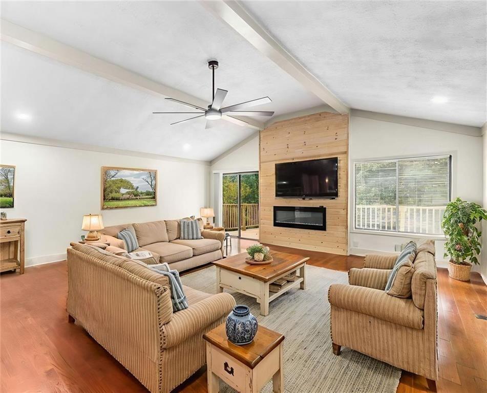 234 Shadow Lake Drive Southwest Lilburn, GA 30047 - Photo 5 of 36 a living room with furniture and a flat screen tv