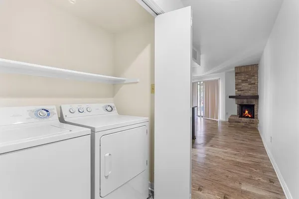 a view of storage and utility room with washer and dryer