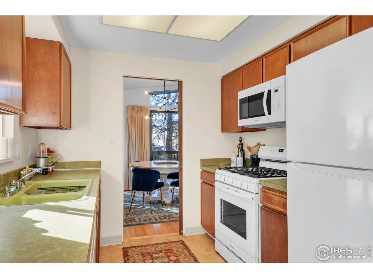 1690 Wilson Court Boulder, CO 80304 - Photo 11 of 48 a kitchen with stainless steel appliances kitchen island a stove a sink and a microwave