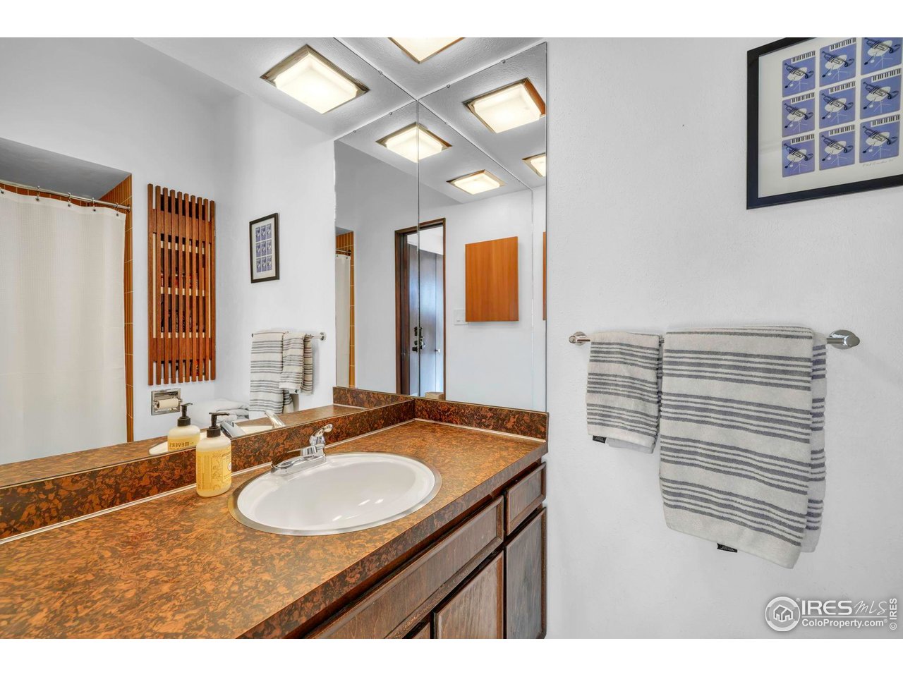 1690 Wilson Court Boulder, CO 80304 - Photo 21 of 48 a bathroom with a sink and a mirror