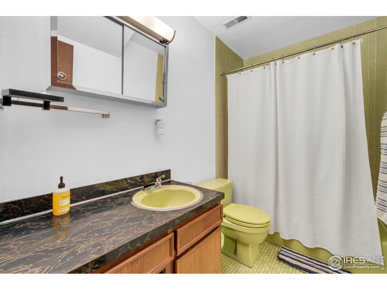 1690 Wilson Court Boulder, CO 80304 - Photo 30 of 48 a bathroom with a sink a toilet and a mirror
