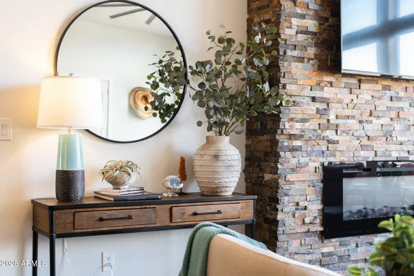 a view of a dining room and livingroom with furniture wooden floor and a rug