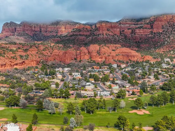 a living room with furniture fireplace and a flat screen tv