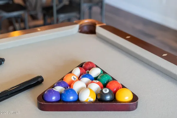 a bed sitting in a bedroom next to a lamp