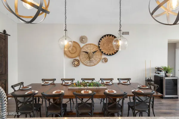 a bathroom with a granite countertop sink a toilet a mirror and shower