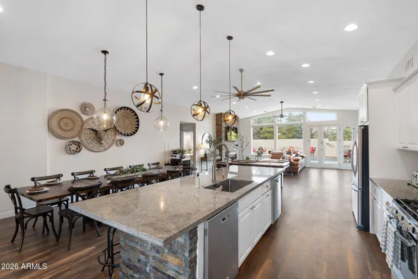 a view of a room with furniture wooden floor and a window