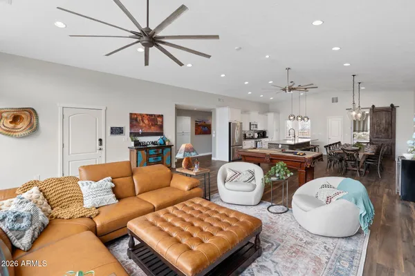 a living room with fireplace furniture and a flat screen tv