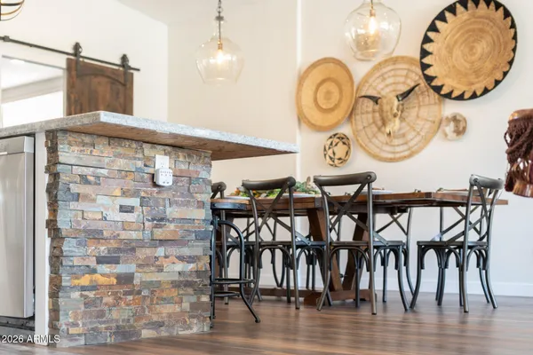 a view of a swimming pool with outdoor seating