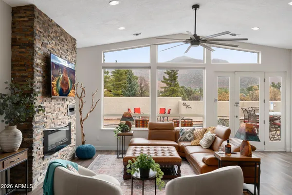 a living room with fireplace furniture and a flat screen tv