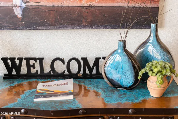 a living room with furniture a table and a large window