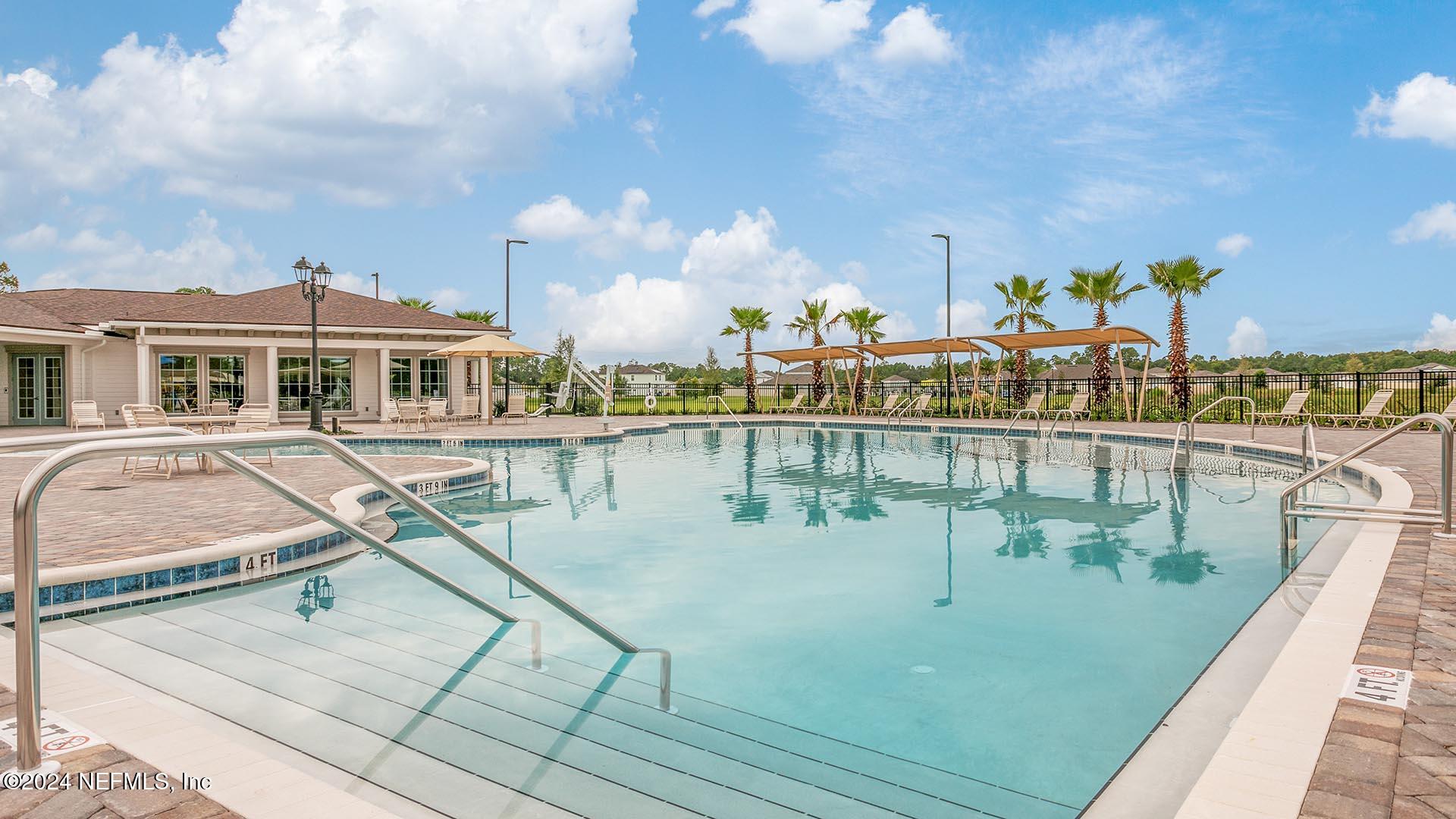 425 Orellana Road St. Augustine, FL 32084 - Photo 29 of 57 a view of a swimming pool with outdoor seating