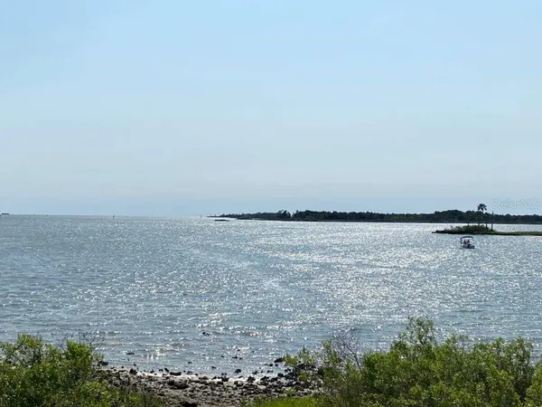 a lake view with mountain view