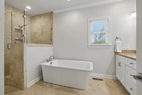 a bedroom with a bed and a night stand