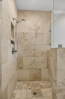 a bedroom with a bed and ceiling fan