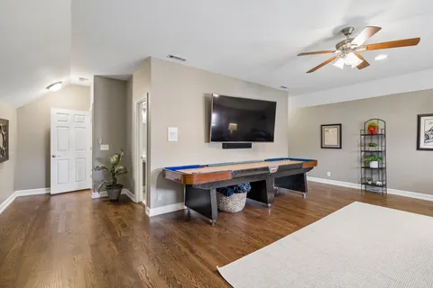 a view of outdoor space with green field and trees