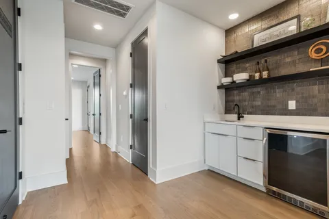 a view of a kitchen cabinets and a stove top oven