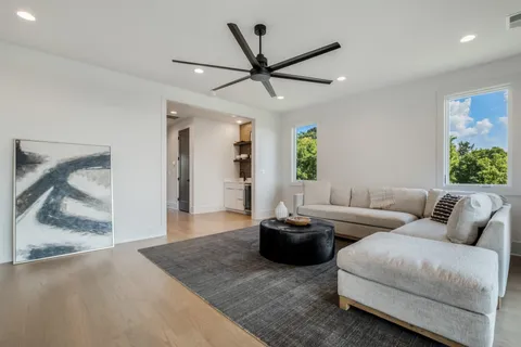 a living room with furniture and a rug