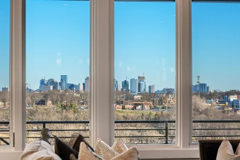 a view of a balcony with city view