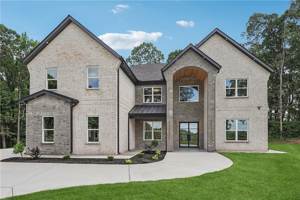 a front view of a house with a yard