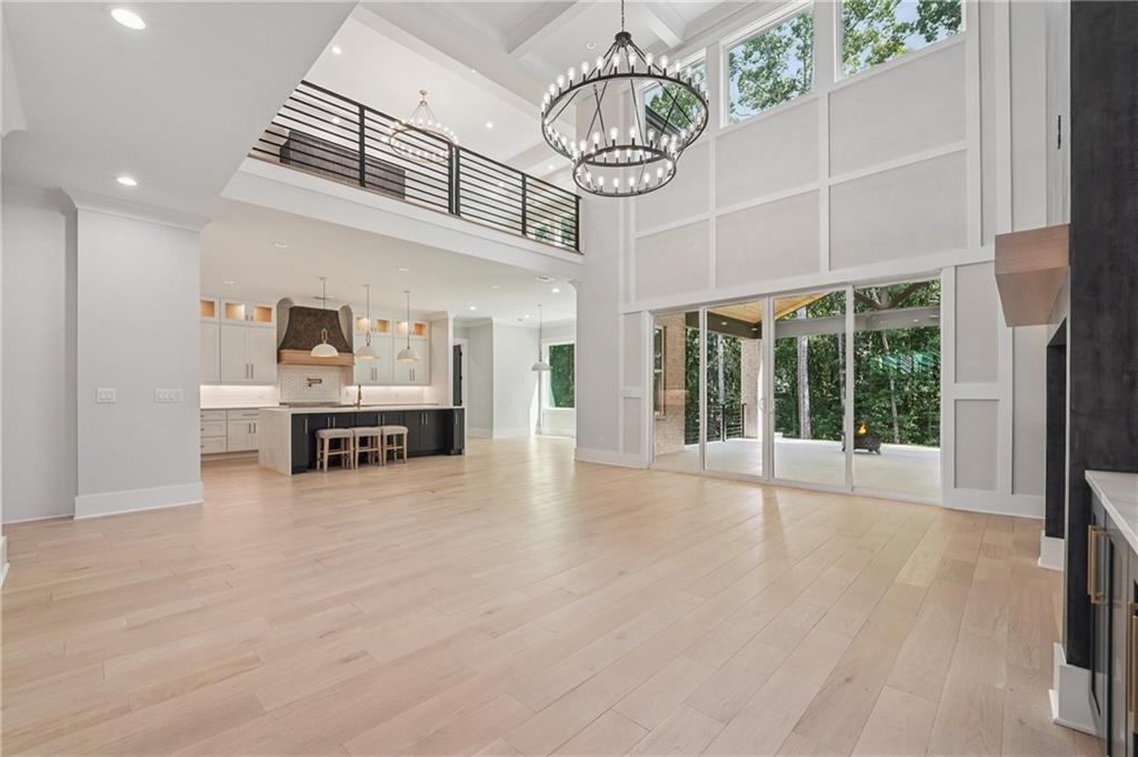 333 Sims Bridge Road Commerce, GA 30530 - Photo 13 of 71 a view of an empty room with wooden floor and a window