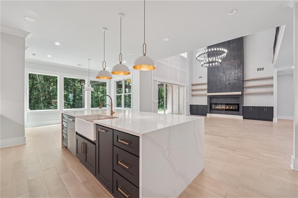 333 Sims Bridge Road Commerce, GA 30530 - Photo 22 of 71 a kitchen with a stove and a large window