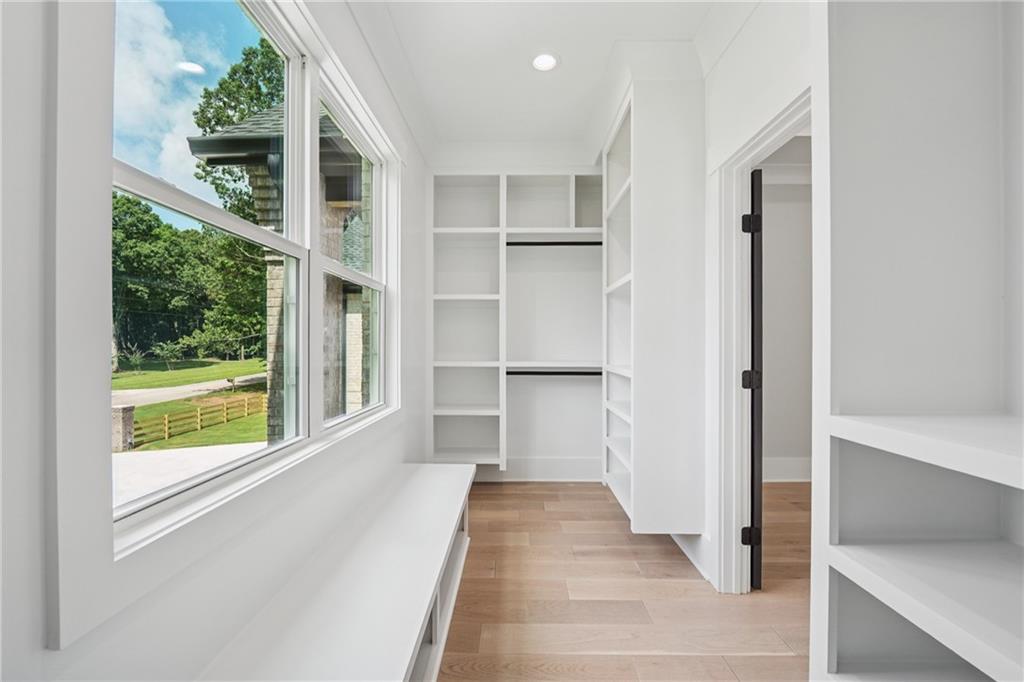 333 Sims Bridge Road Commerce, GA 30530 - Photo 50 of 71 a view of a hallway with wooden floors and windows