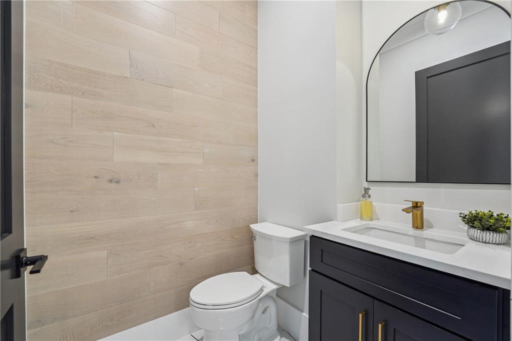 333 Sims Bridge Road Commerce, GA 30530 - Photo 57 of 71 a bathroom with a sink a toilet a mirror and shower