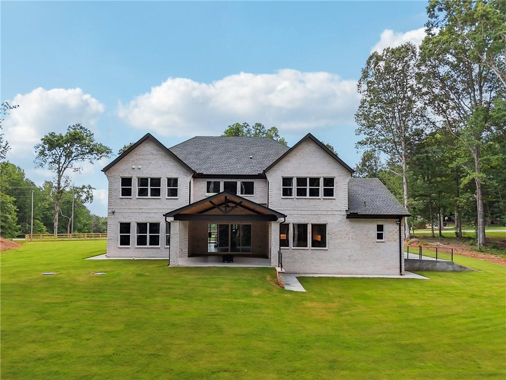 333 Sims Bridge Road Commerce, GA 30530 - Photo 64 of 71 a front view of a house with a garden