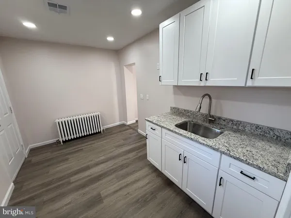 a kitchen with a sink and cabinets